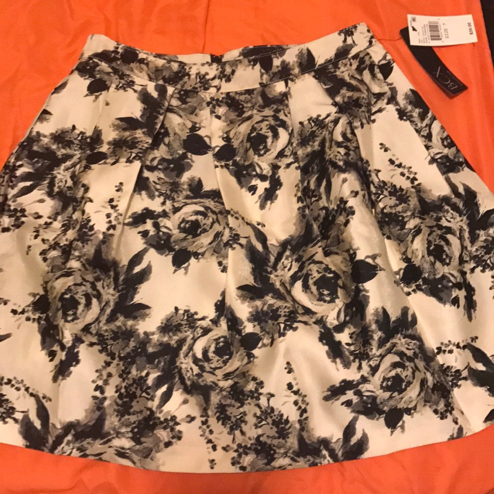 Black, white satin ruffles BCX skirt.